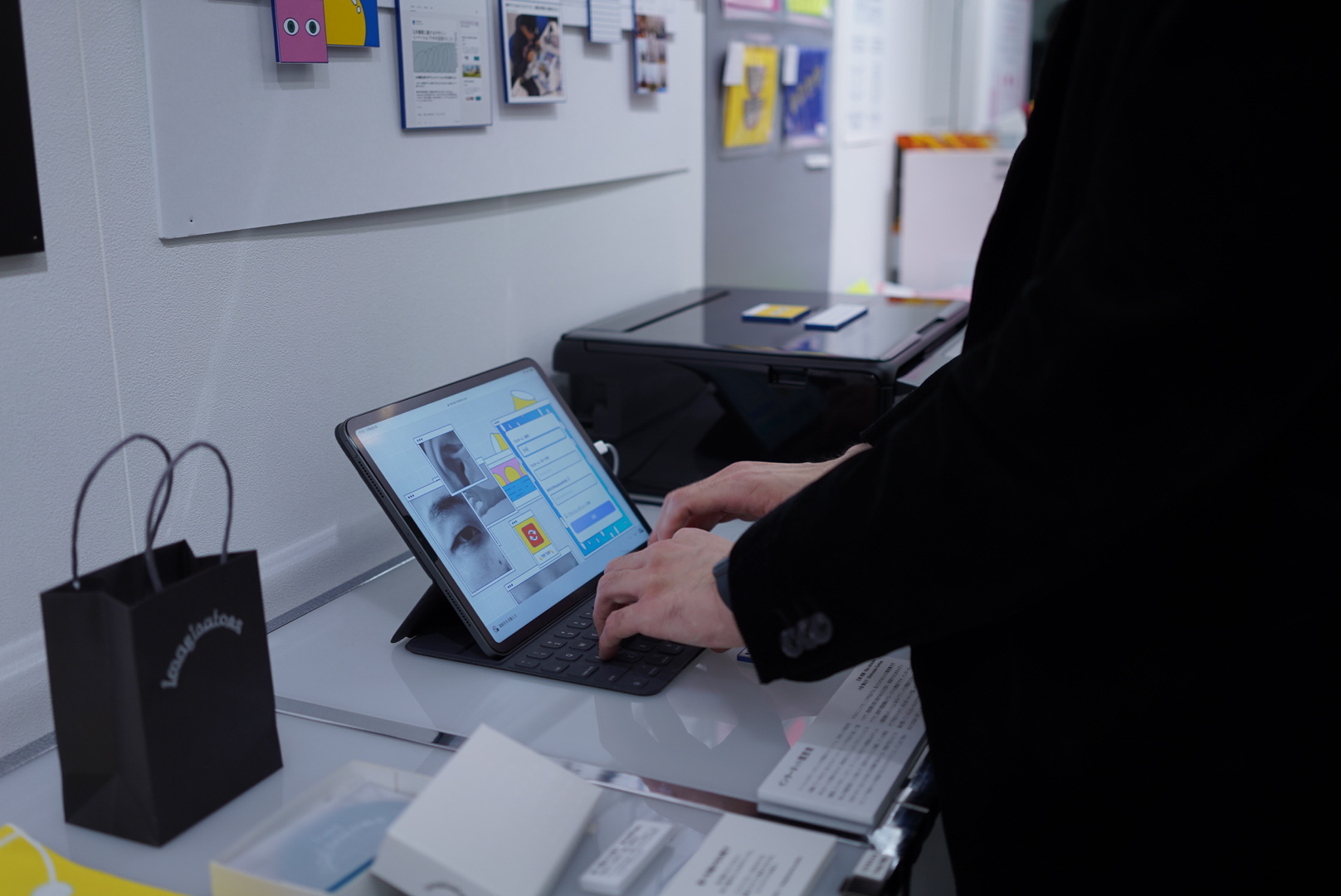 A second visitor interacting with the colorful Internet Résumé interface at the exhibition